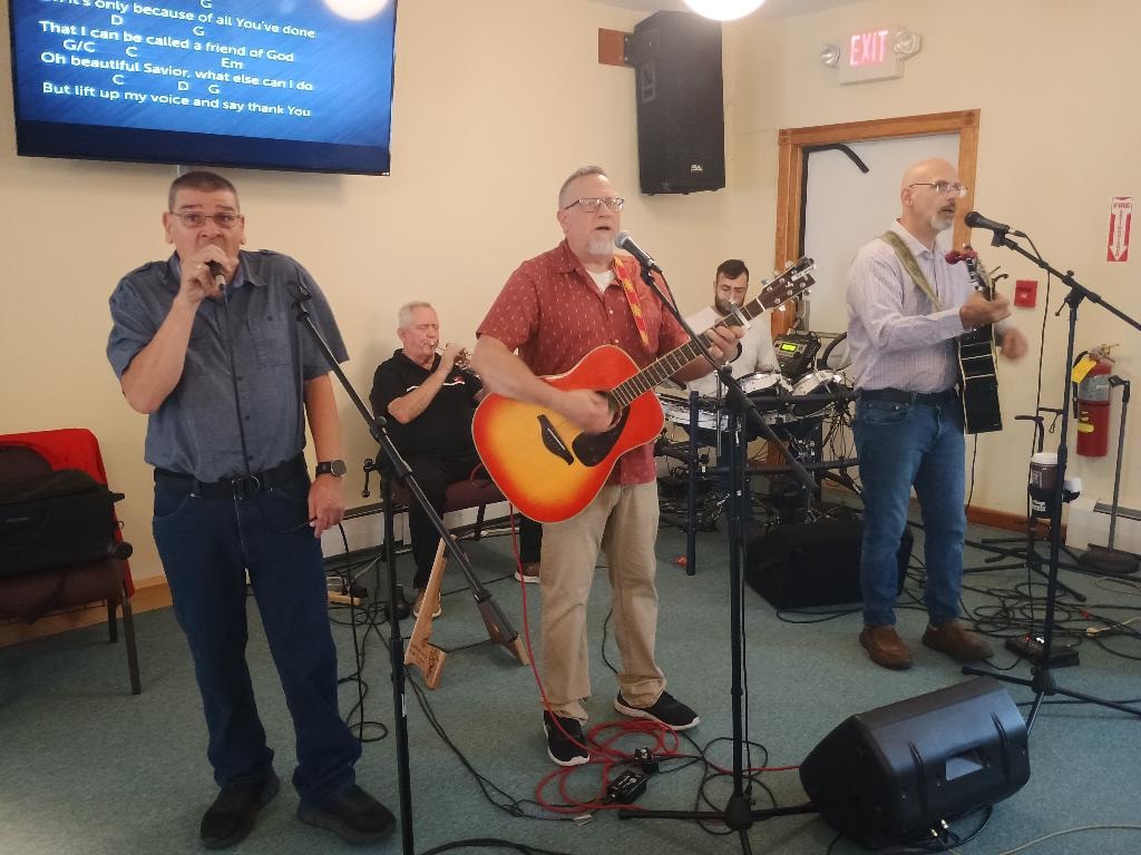 Congregation gathered in prayer during morning worship service