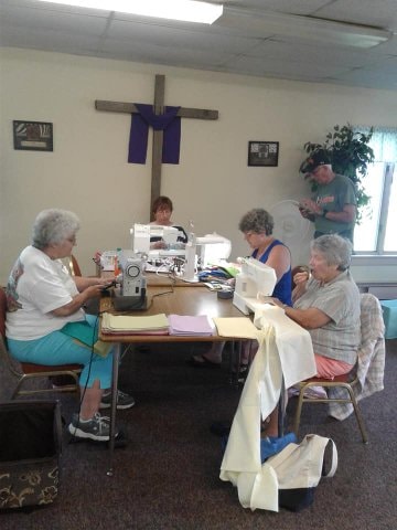 Sewing ministry members working together